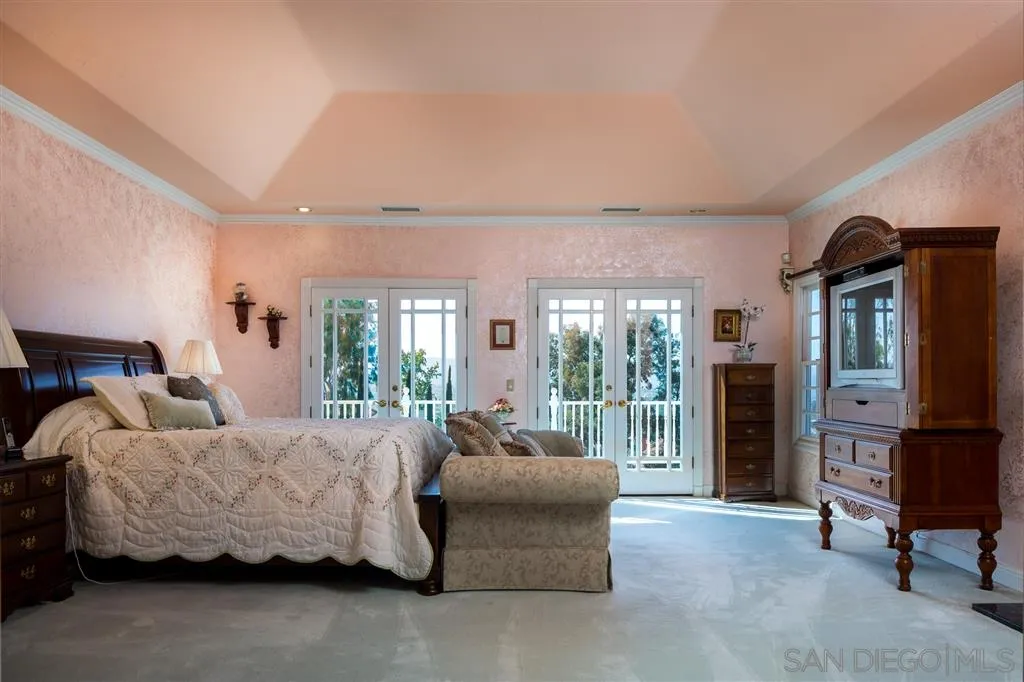 12966 Lomas Verdes Drive Poway, CA 92064 - Photo 20 of 25 a bedroom with furniture and large windows