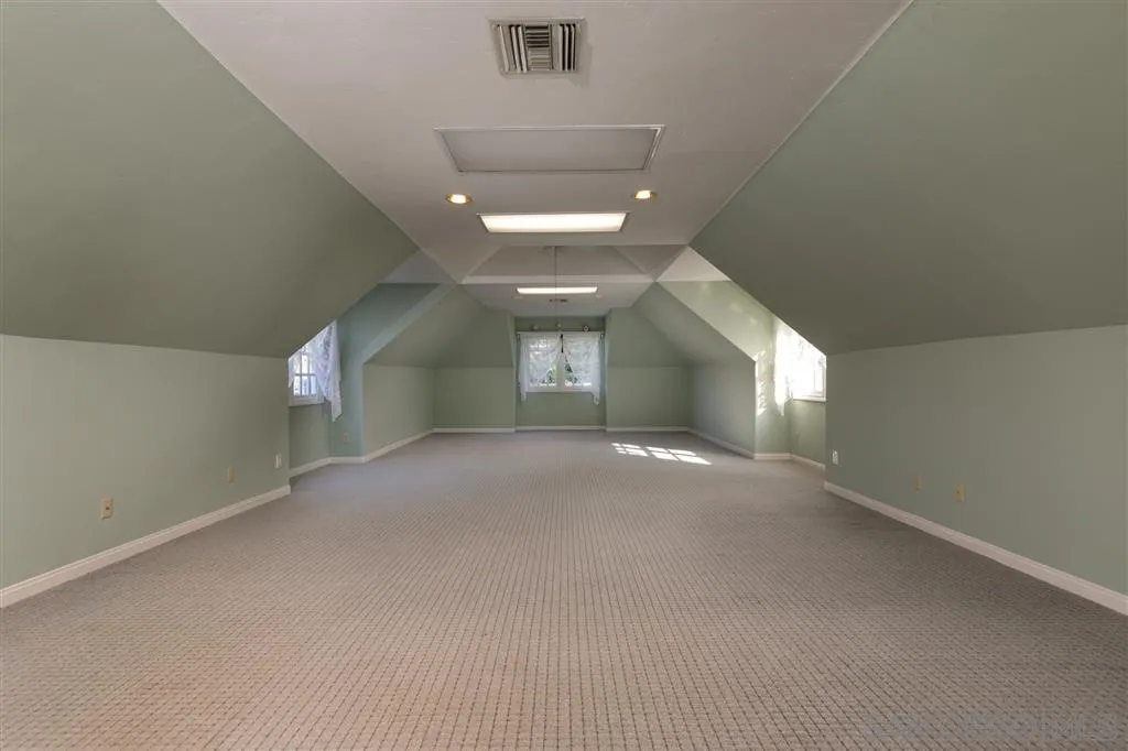 12966 Lomas Verdes Drive Poway, CA 92064 - Photo 23 of 25 an empty room with a empty space and a window