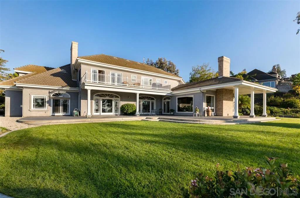 12966 Lomas Verdes Drive Poway, CA 92064 - Photo 4 of 25 a front view of a house with a garden