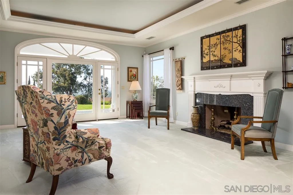 12966 Lomas Verdes Drive Poway, CA 92064 - Photo 8 of 25 a living room with furniture and a fireplace