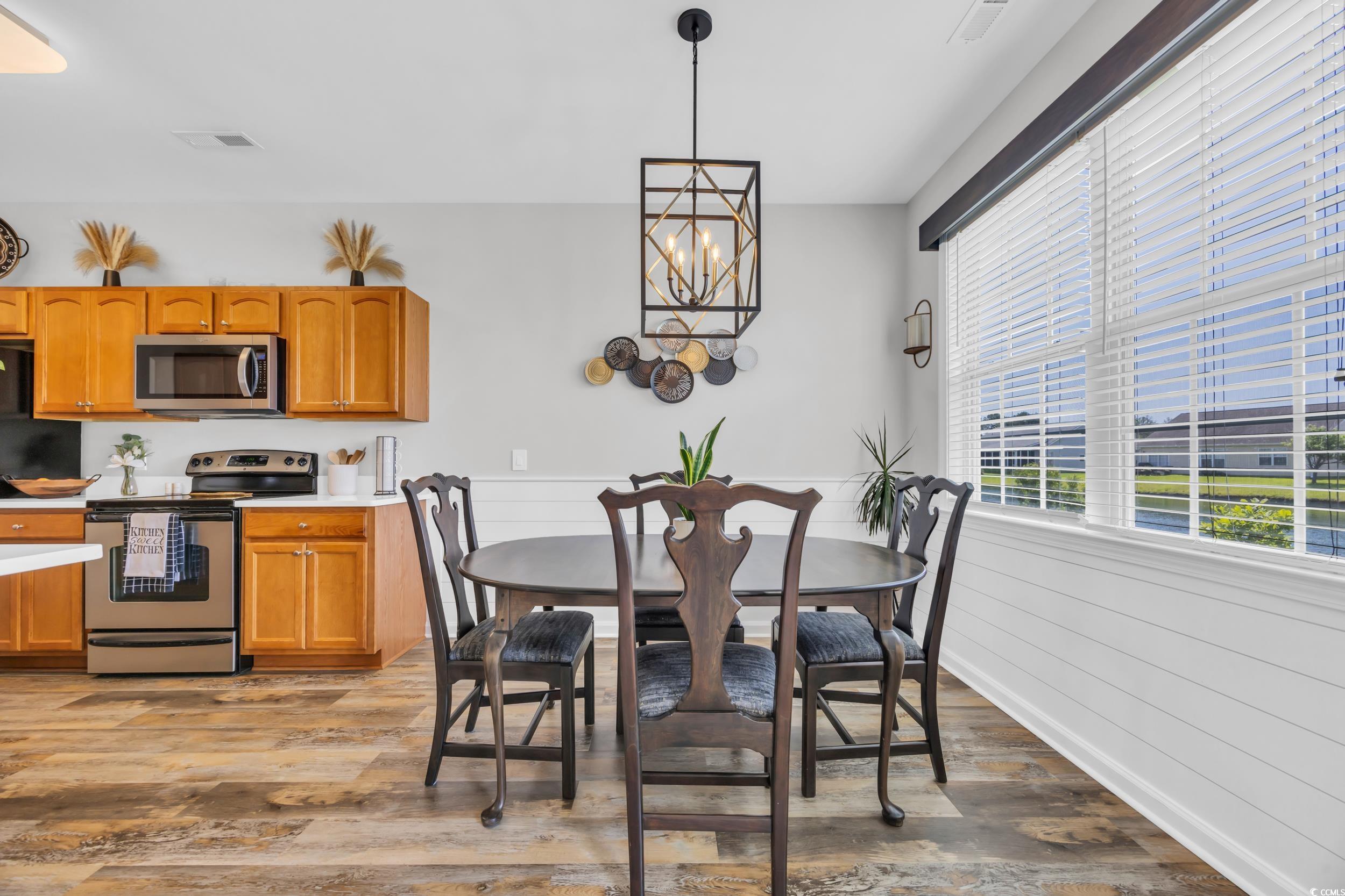 1451 Virginia Pine Drive Longs, SC 29568 - Photo 11 of 29 Dining room featuring wood finished floors, wainsc