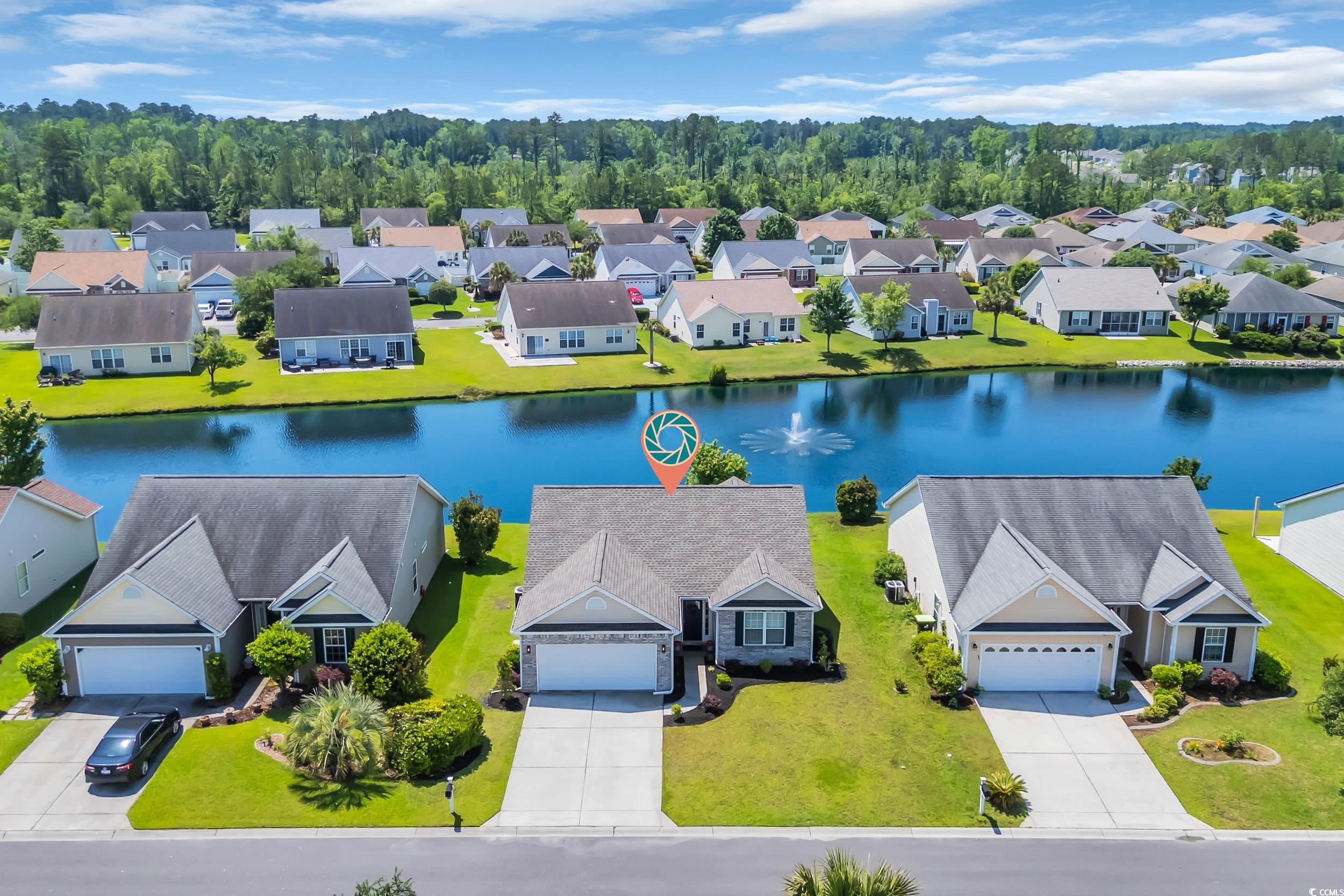1451 Virginia Pine Drive Longs, SC 29568 - Photo 2 of 29 Aerial perspective of suburban area with a large b