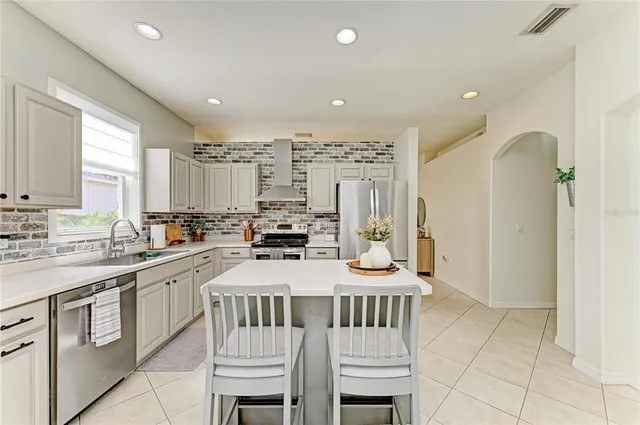 a bedroom with a bed and a ceiling fan