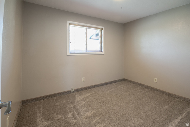 634 South 2100th Street West Vernal, UT 84078 - Photo 46 of 71 Neutral-toned room with a single window featuring horizontal blinds