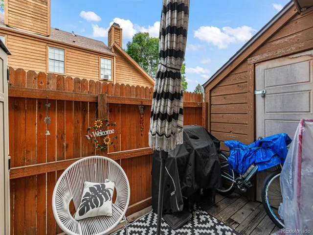 a front view of a house with barbeque oven and stairs
