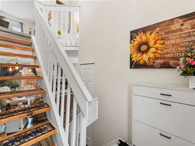 a view of an entryway with wooden floor