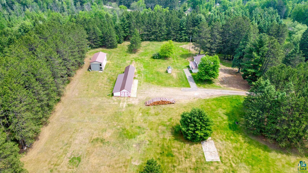 4755 Judd Road Gilbert, MN 55741 - Photo 50 of 50 Aerial view of property and surrounding area featuring a heavily wooded area