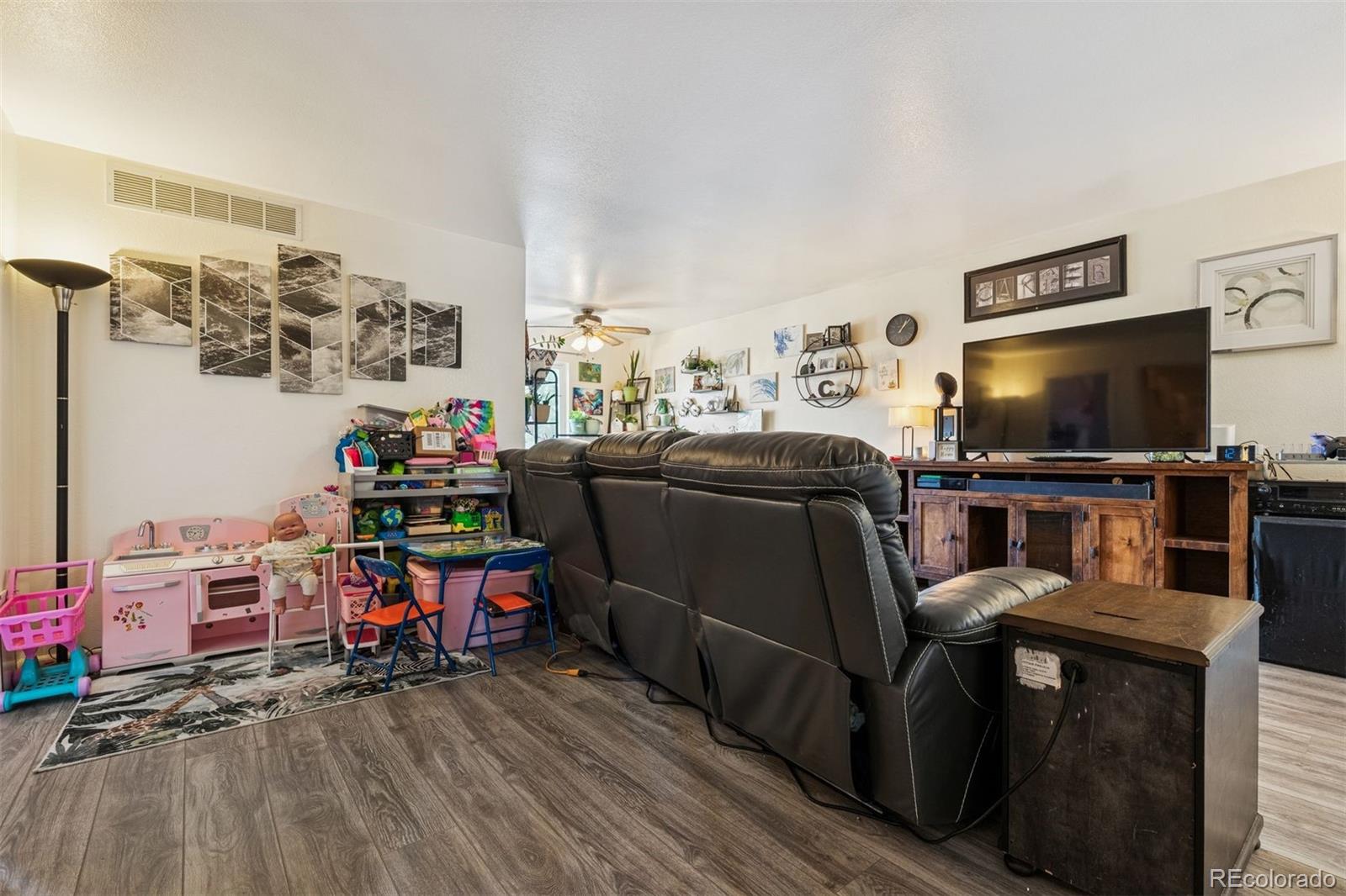 3820 Riverside Parkway Evans, CO 80620 - Photo 14 of 25 a view of a workspace with furniture and a flat screen tv