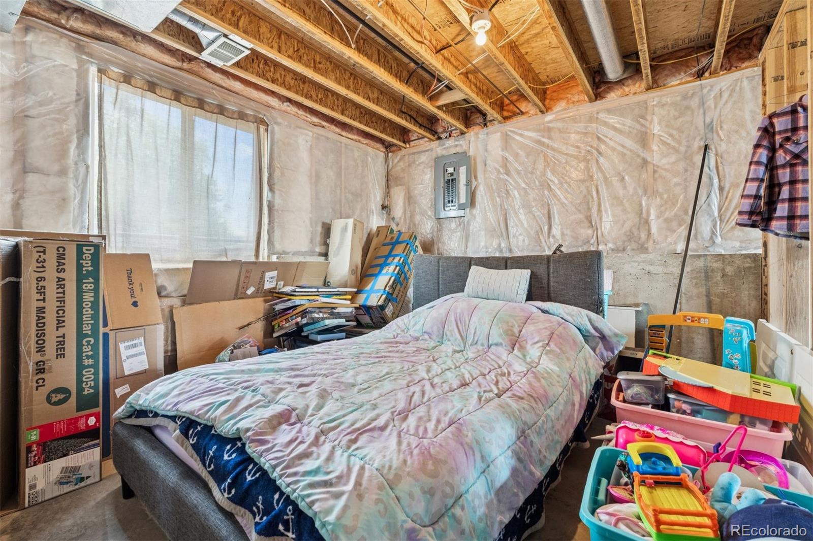 3820 Riverside Parkway Evans, CO 80620 - Photo 15 of 25 a bed sitting in a bedroom next to a window