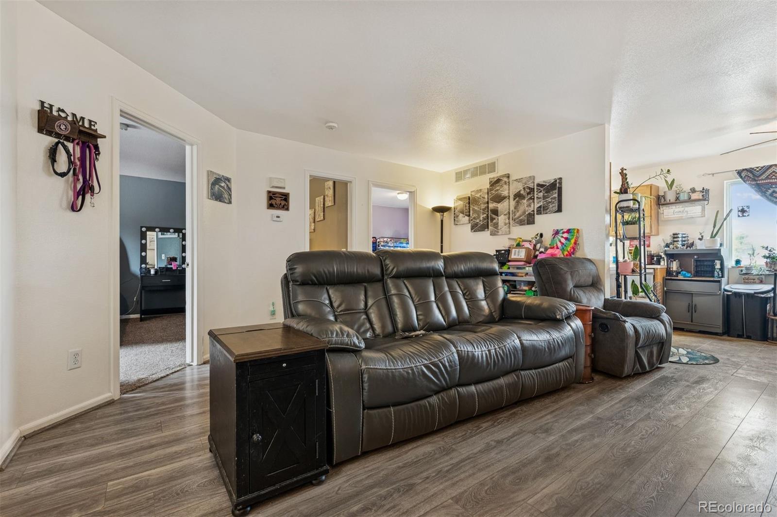 3820 Riverside Parkway Evans, CO 80620 - Photo 2 of 25 a living room with furniture with wooden floor