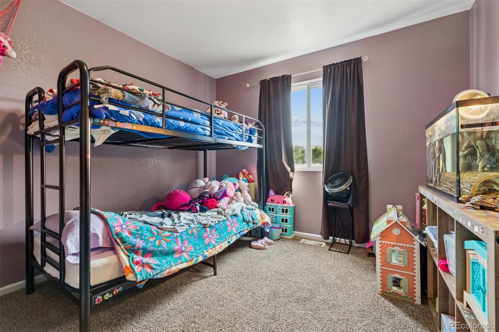 3820 Riverside Parkway Evans, CO 80620 - Photo 5 of 25 a bedroom with bed and a window