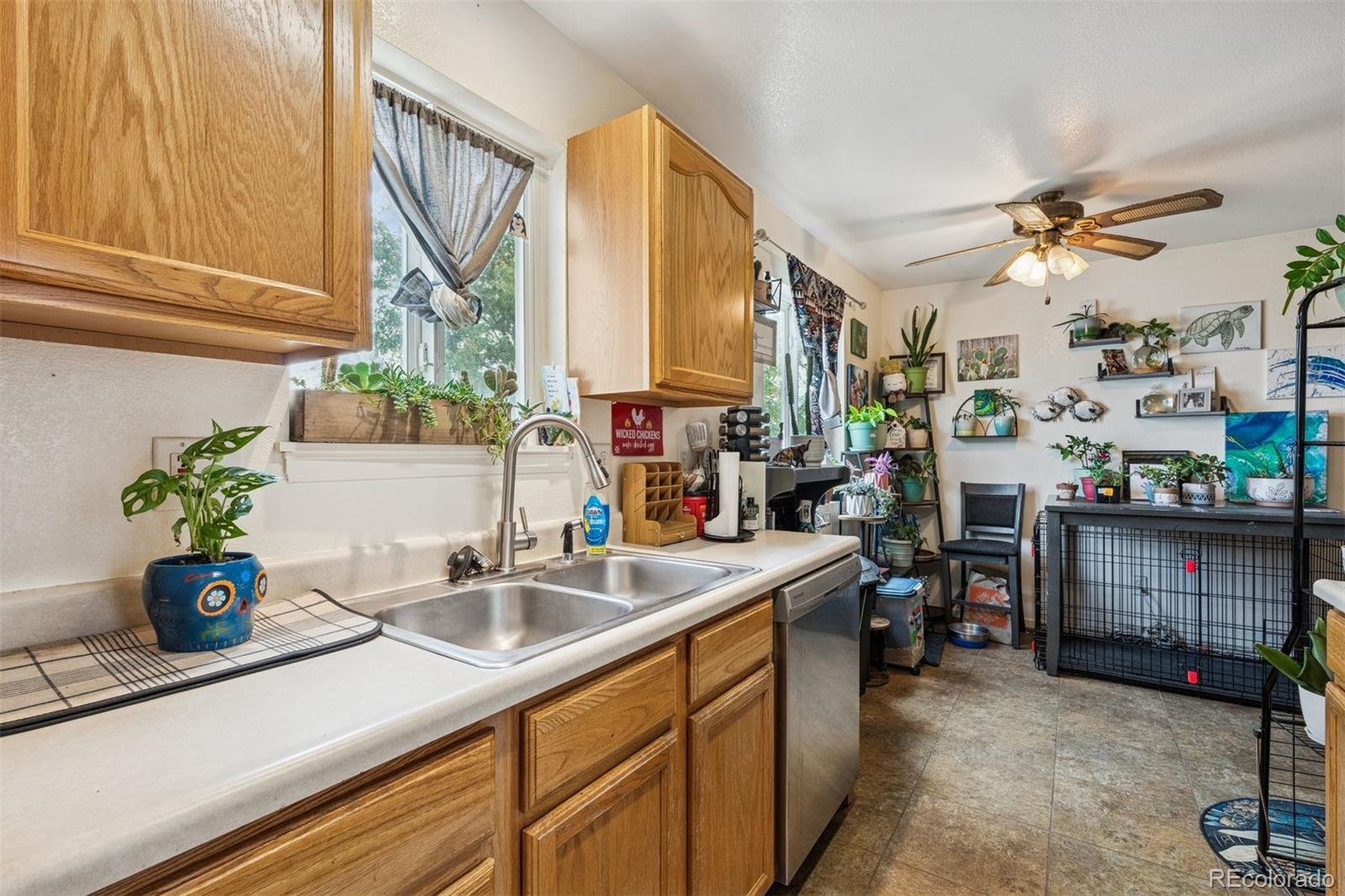 3820 Riverside Parkway Evans, CO 80620 - Photo 6 of 25 a kitchen with a sink appliances and a counter top space