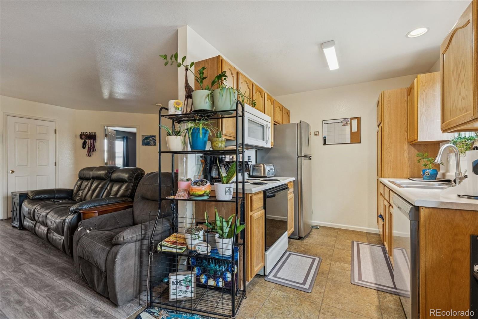 3820 Riverside Parkway Evans, CO 80620 - Photo 7 of 25 a living room with furniture and a fireplace