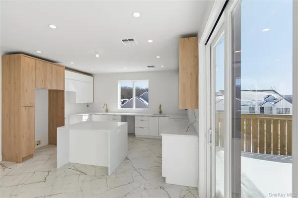 a kitchen with a sink and refrigerator