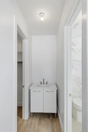 a utility room with cabinets washer and dryer