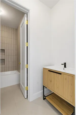 a bathroom with a bathtub and shower