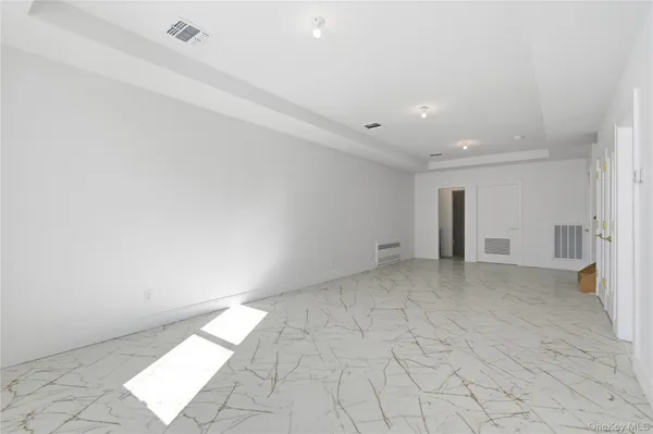 a view of a livingroom with stairs
