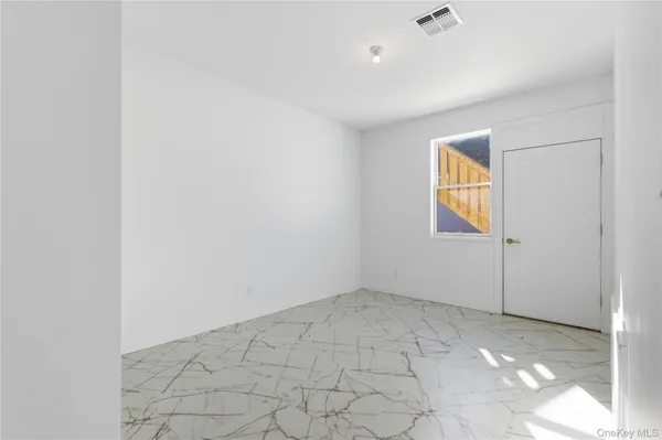 a view of a room with white walls