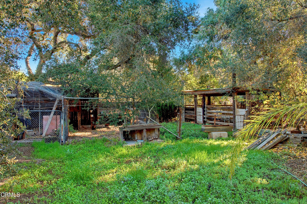 1400 Park Road Ojai, CA 93023 - Photo 17 of 67 a view of a chair and table in backyard of the house