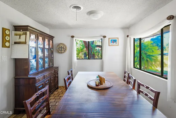 a bedroom with two bed and a window