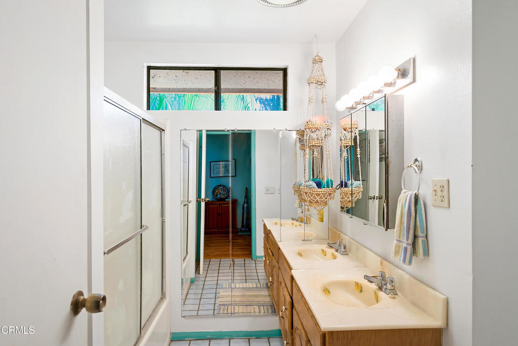 1400 Park Road Ojai, CA 93023 - Photo 35 of 67 a bathroom with a sink a mirror and a shower