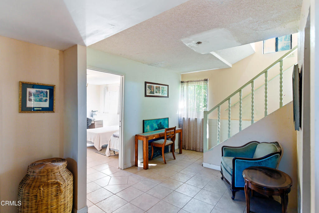1400 Park Road Ojai, CA 93023 - Photo 37 of 67 a living room with furniture and a chair