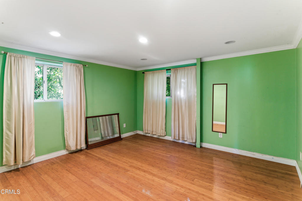 1400 Park Road Ojai, CA 93023 - Photo 55 of 67 a view of an empty room with wooden floor and a window