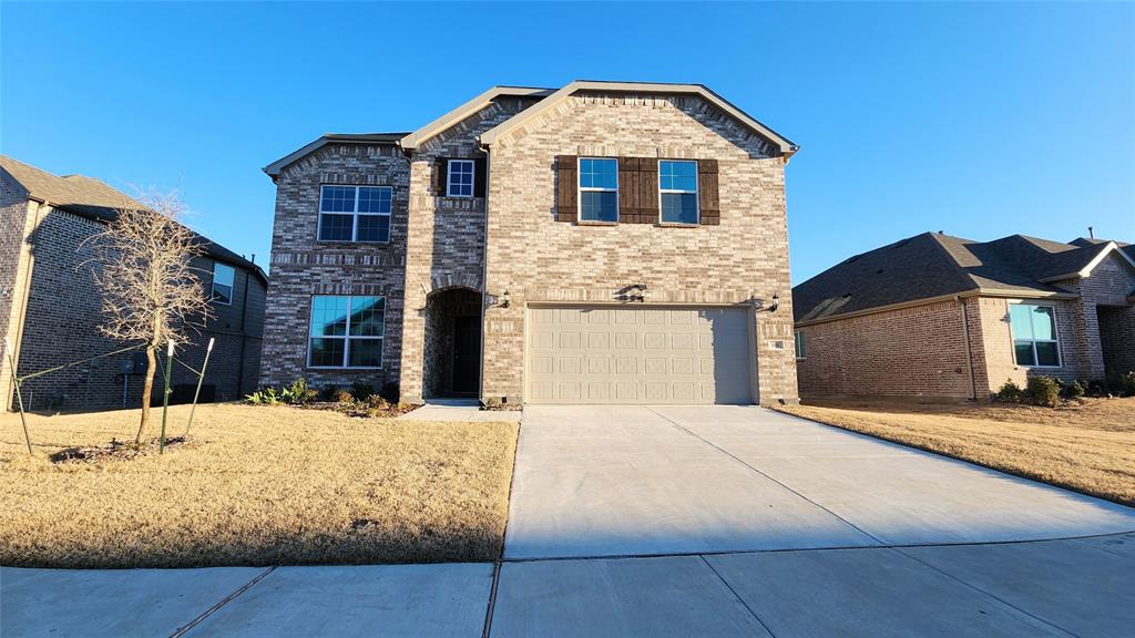 916 Elizabeth Street Anna, TX 75409 - Photo 1 of 31 a front view of a house with a yard