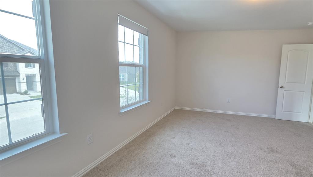 916 Elizabeth Street Anna, TX 75409 - Photo 12 of 31 an empty room with a window