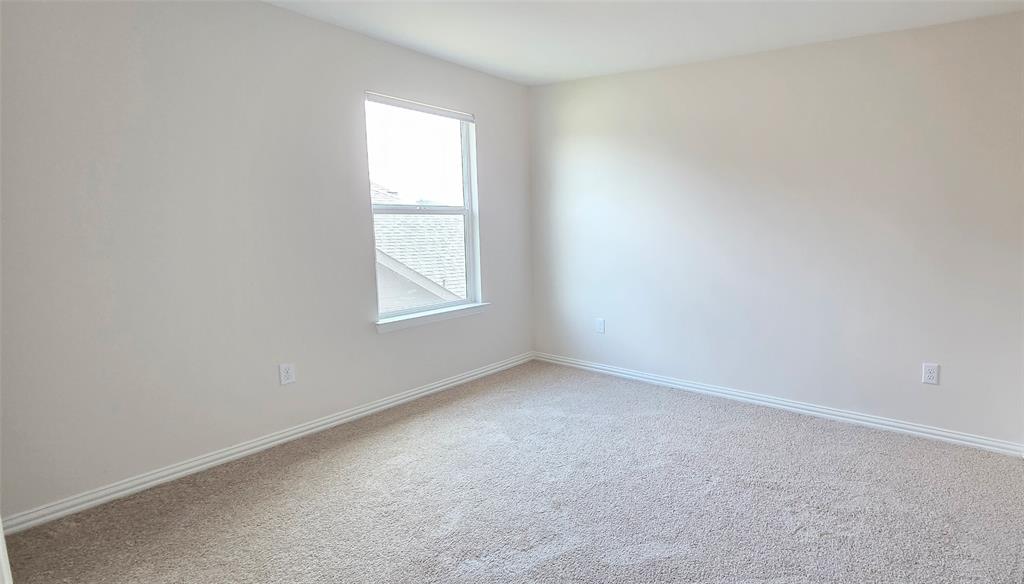 916 Elizabeth Street Anna, TX 75409 - Photo 14 of 31 an empty room with a window