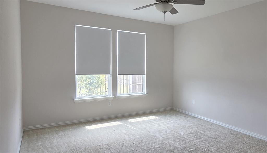 916 Elizabeth Street Anna, TX 75409 - Photo 16 of 31 an empty room with a window