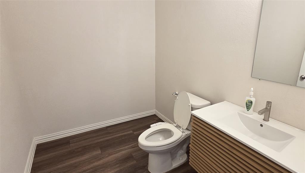 916 Elizabeth Street Anna, TX 75409 - Photo 21 of 31 a bathroom with a sink and a toilet