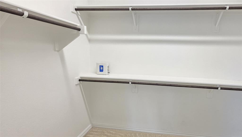 916 Elizabeth Street Anna, TX 75409 - Photo 25 of 31 a view of small space with racks on the wall