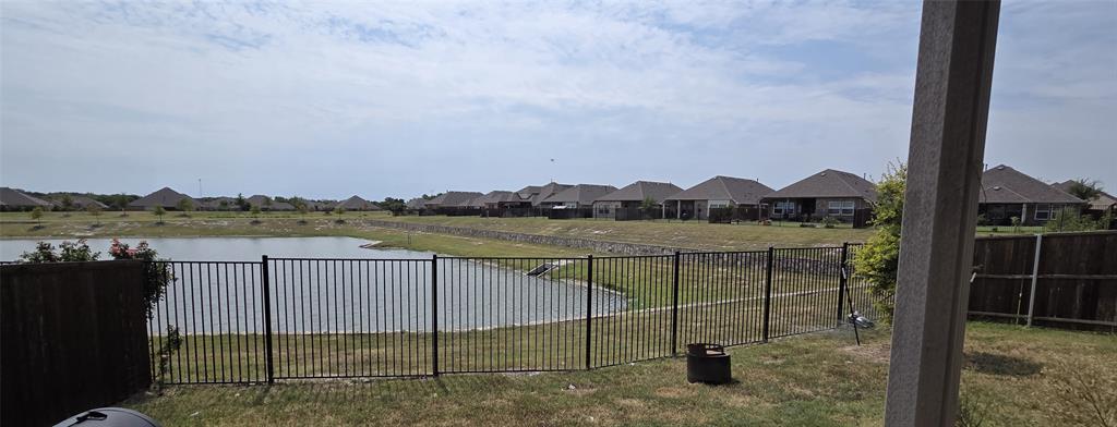 916 Elizabeth Street Anna, TX 75409 - Photo 29 of 31 a view of a lake with a terrace
