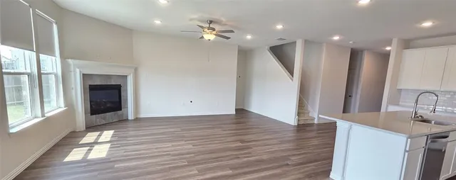 a view of a kitchen with a sink and a chandelier