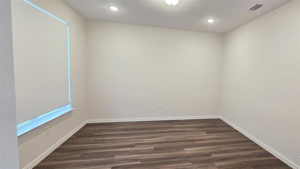 916 Elizabeth Street Anna, TX 75409 - Photo 6 of 31 a view of room with wooden floor