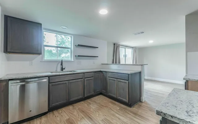 a kitchen with sink and window