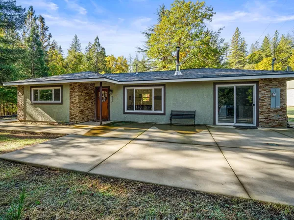 a house with trees in the background