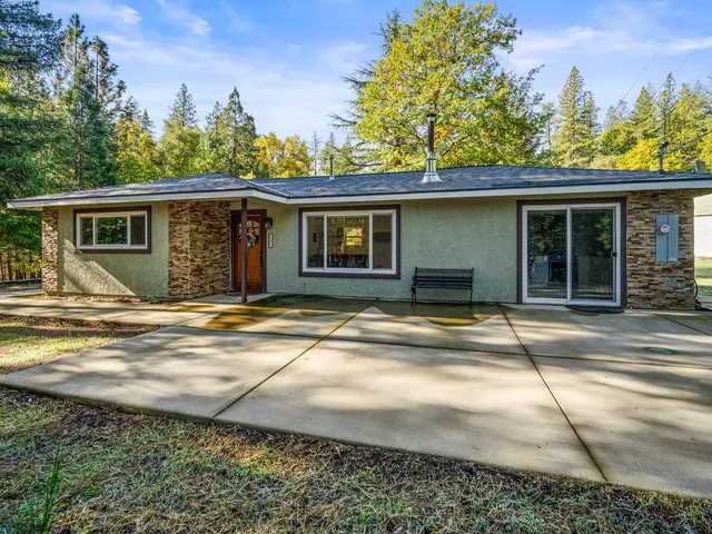 a house with trees in the background