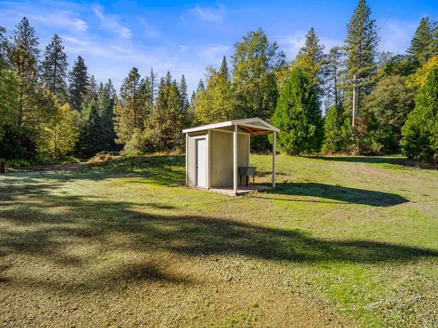 a backyard of a house with lots of green space
