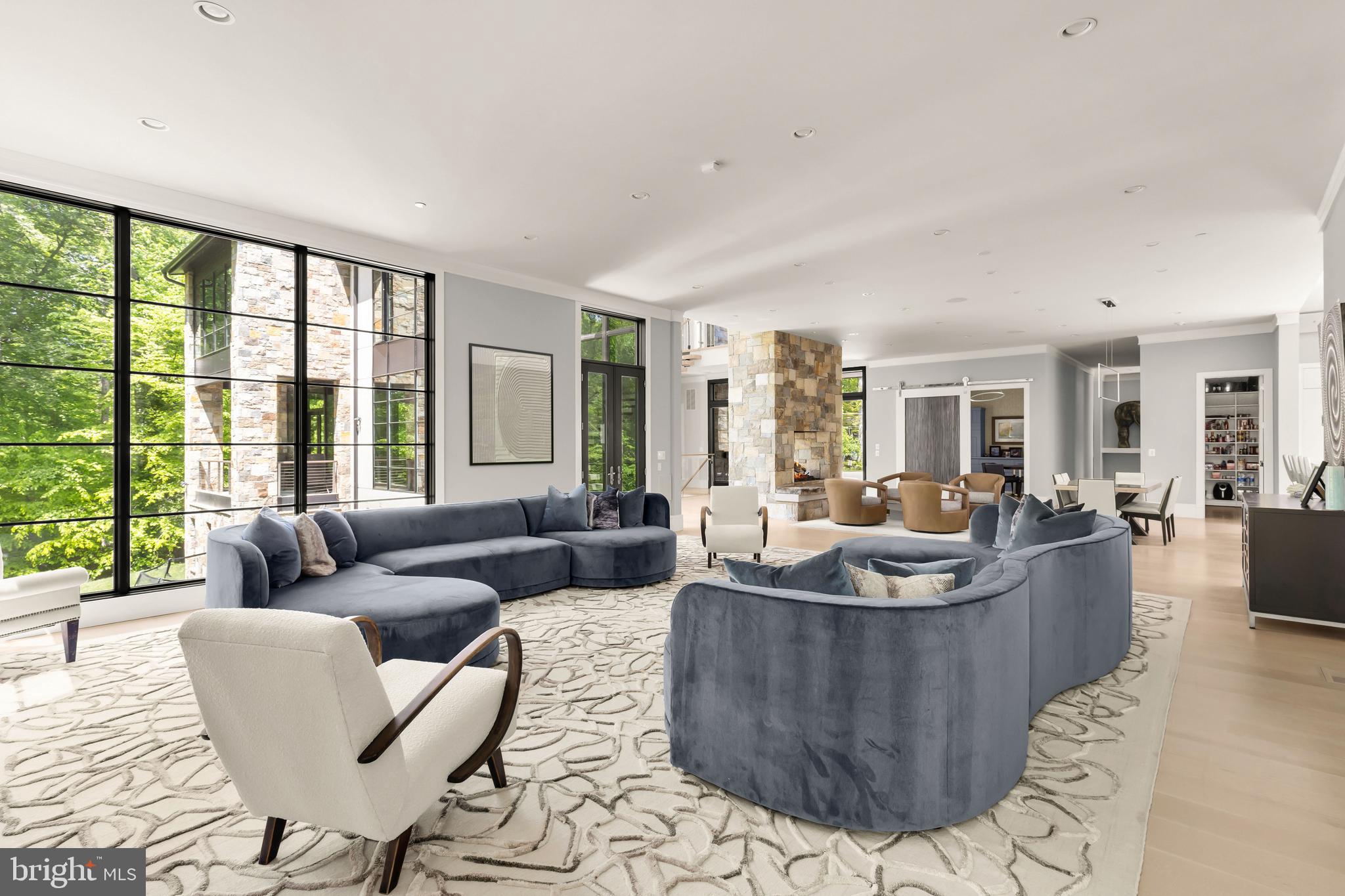 3 Bay Tree Lane Bethesda, MD 20816 - Photo 11 of 50 a living room with furniture and a large window