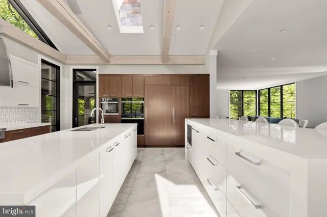 a large white tub with double vanity