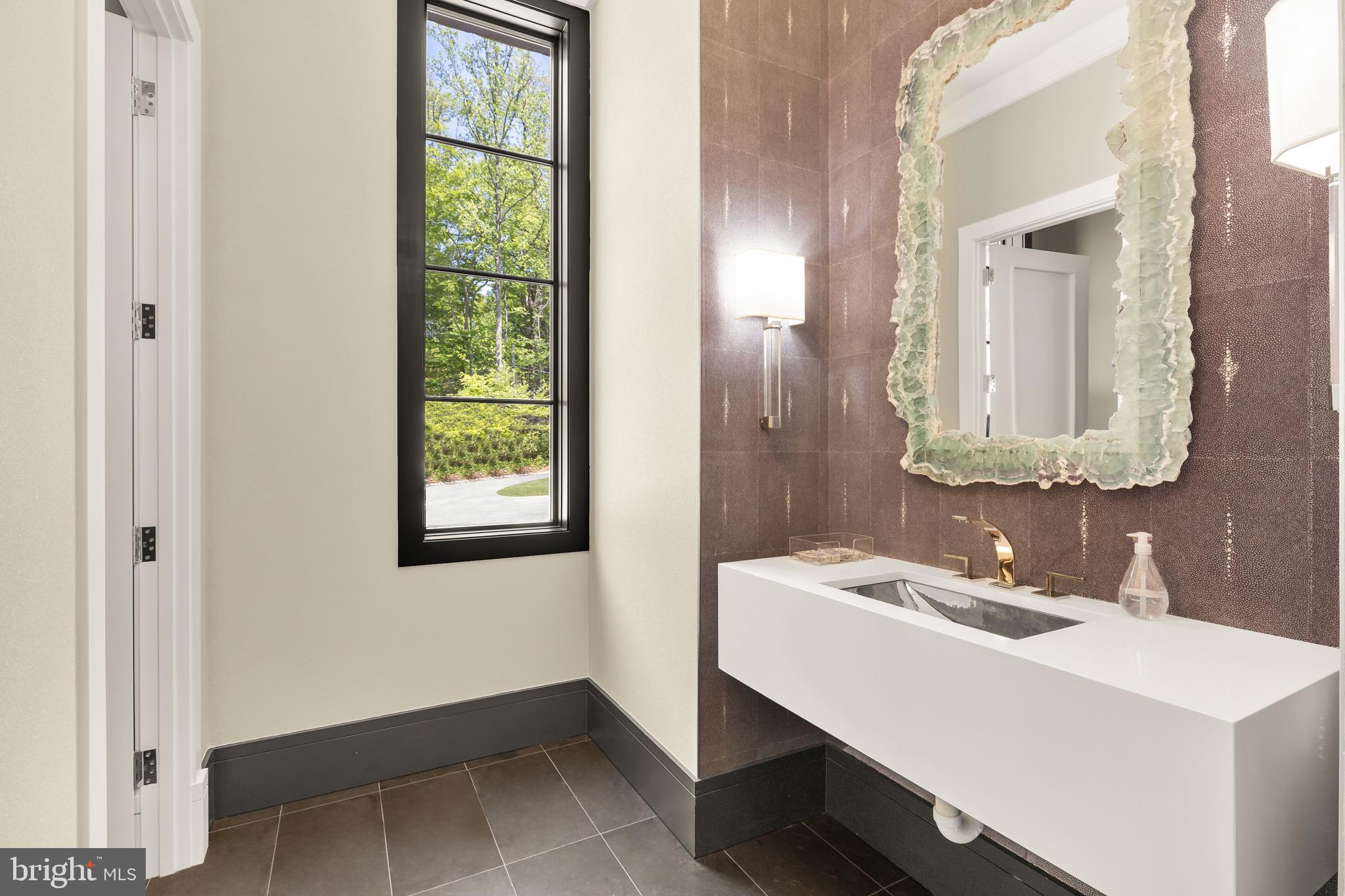 3 Bay Tree Lane Bethesda, MD 20816 - Photo 24 of 50 a bathroom with a sink and a mirror