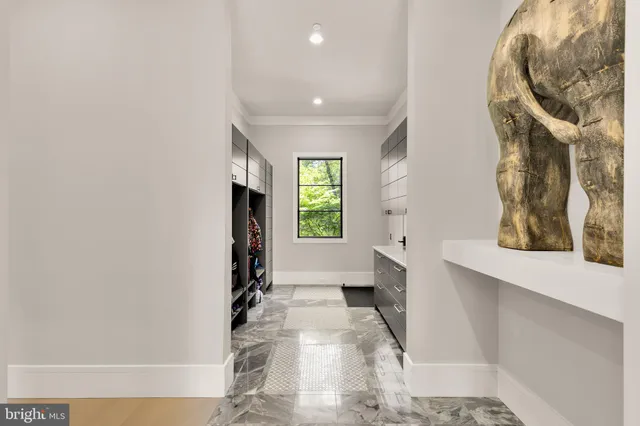 a view of an entryway with wooden floor