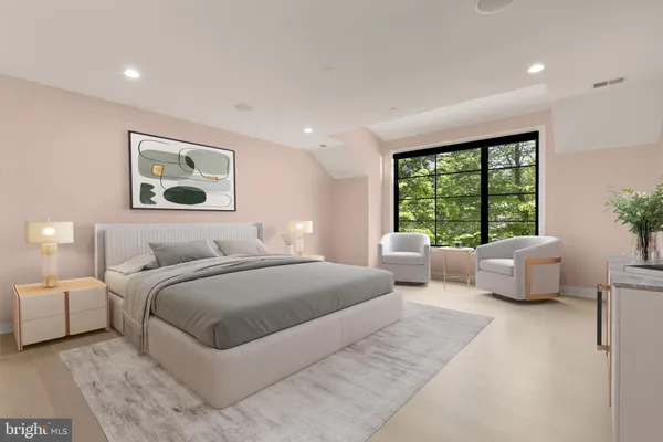 a bedroom with a large bed and a couch