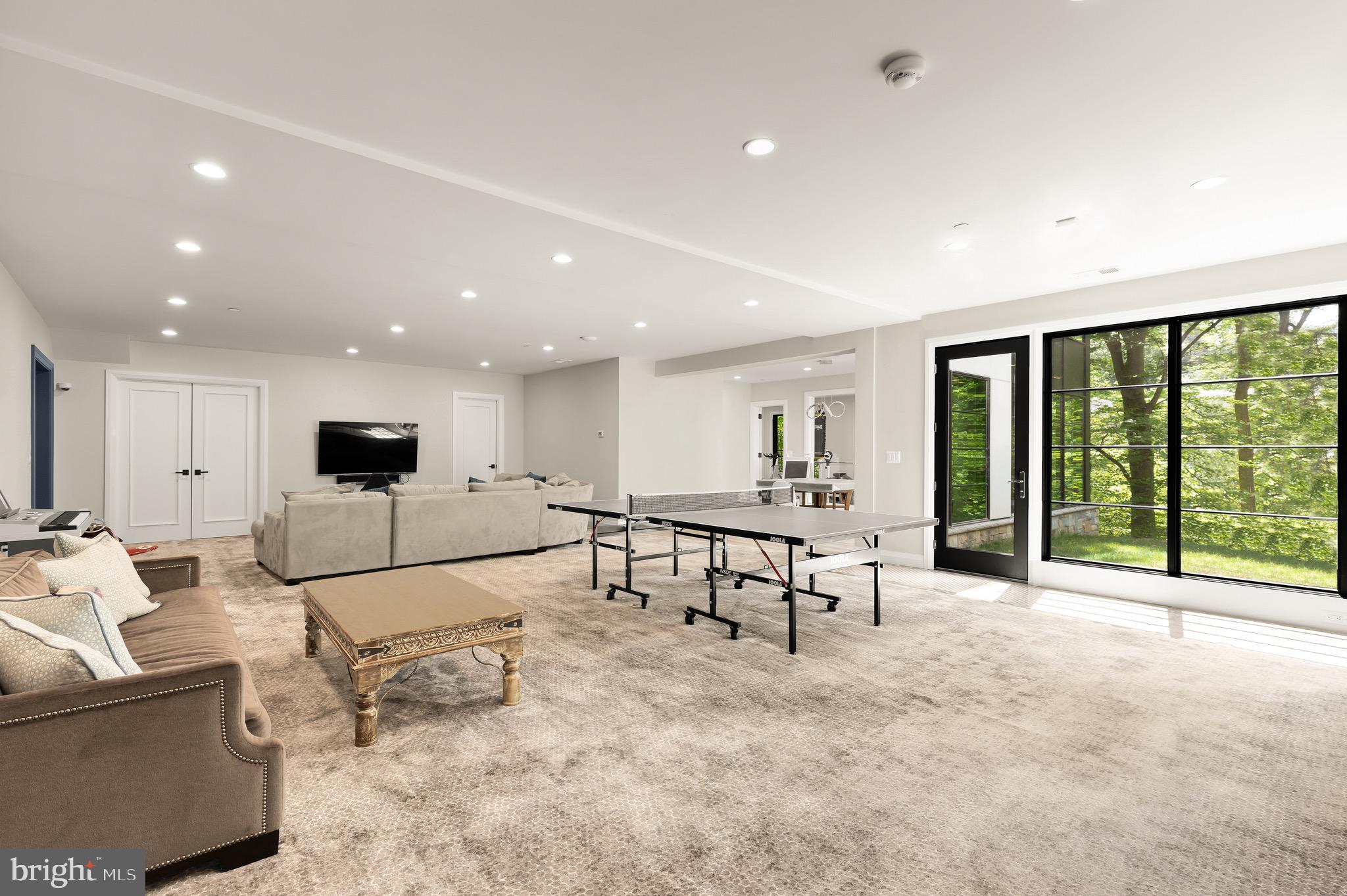 3 Bay Tree Lane Bethesda, MD 20816 - Photo 36 of 50 a living room with furniture and a large window