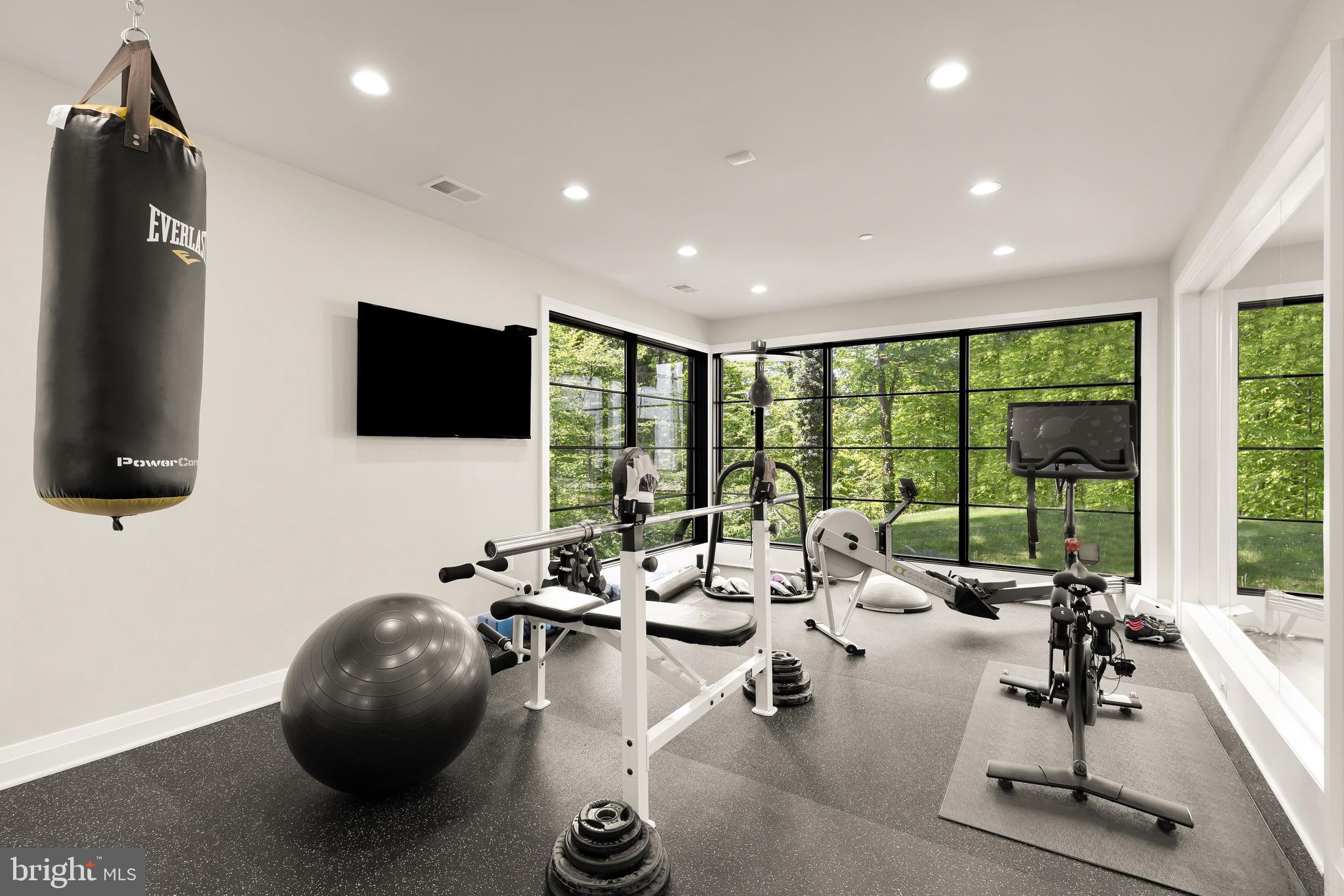 3 Bay Tree Lane Bethesda, MD 20816 - Photo 39 of 50 a room with gym equipment and a large window