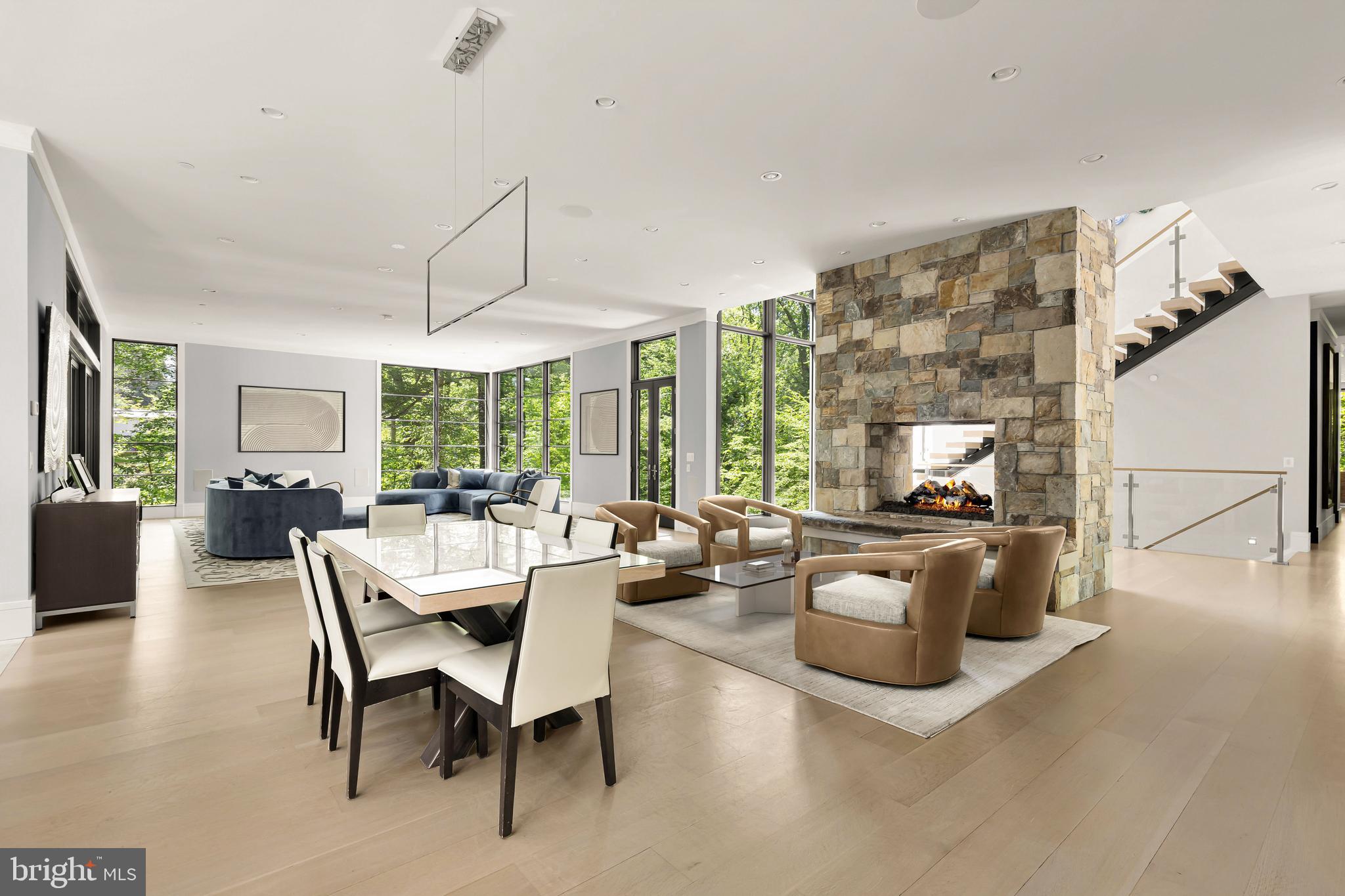 3 Bay Tree Lane Bethesda, MD 20816 - Photo 9 of 50 a living room with furniture a flat screen tv and a large window