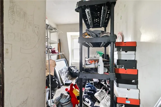 a bed room with a bed and a chandelier