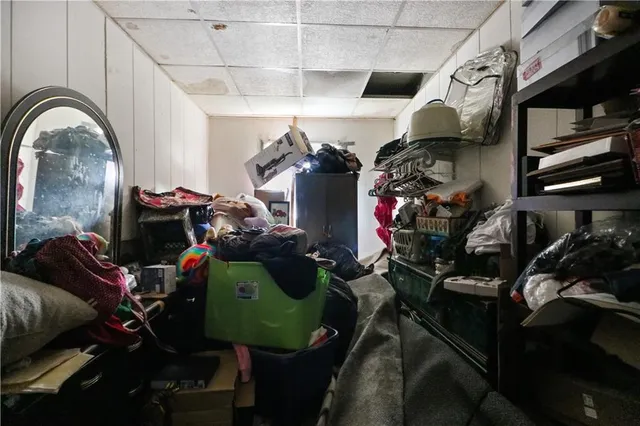 a bathroom with a granite countertop sink a toilet and shower